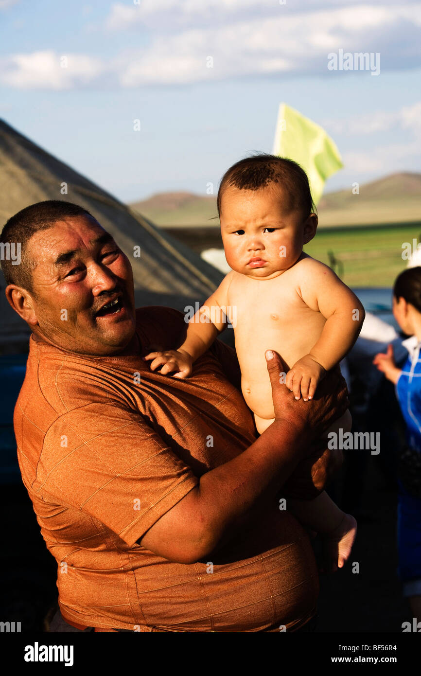 mongolian-man-holding-his-baby-xilamuren