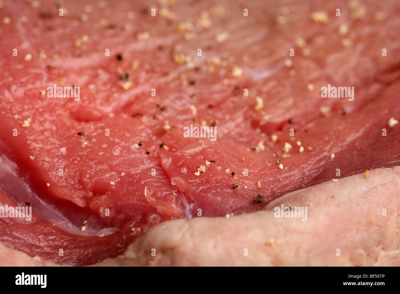 close up of slice of seasoned chump steak from organic longhorn irish cows Stock Photo