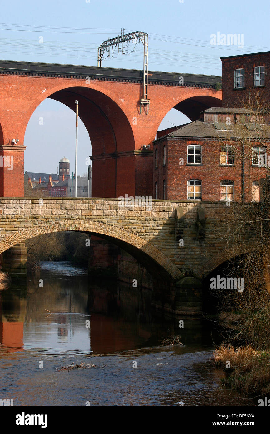 England, Cheshire, Stockport, River Mersey passing under Rail Viaduct Europe's largest brick-built structure Stock Photo