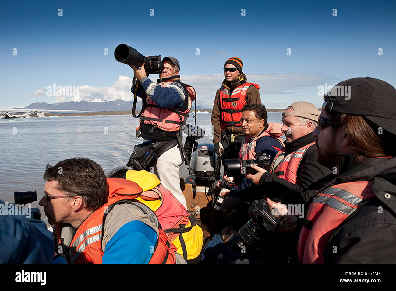 Tourist  taking pictures on Fjallsarlon lagoon , Eastern Iceland Stock Photo