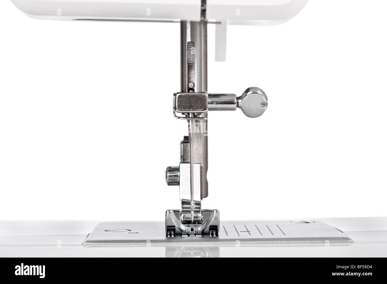 Needle plate, foot and transporter of a sewing machine Stock Photo Alamy