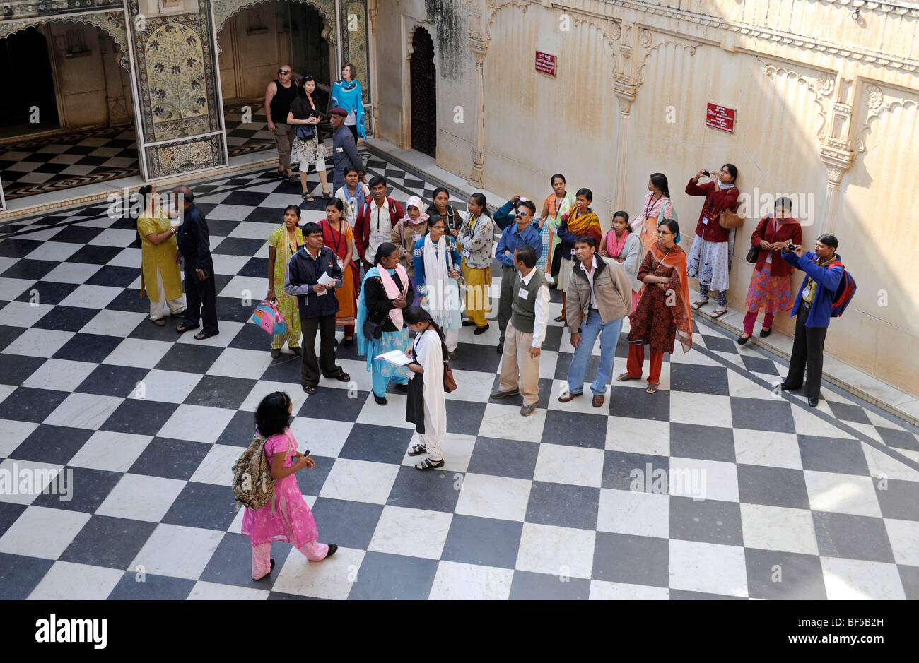 Indian group of visitors in the city palace, Udaipur, Rajasthan, North India, India, South Asia, Asia Stock Photo