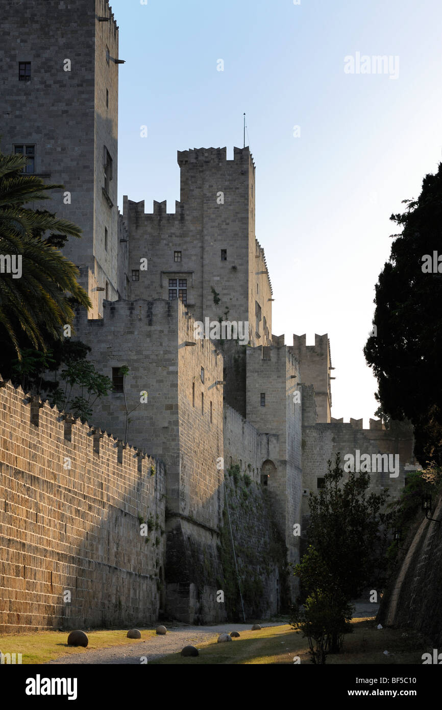 Part of the Grand Master's Palace with city walls seen from the moat, Rhodes Town, Rhodes, Greece, Europe Stock Photo