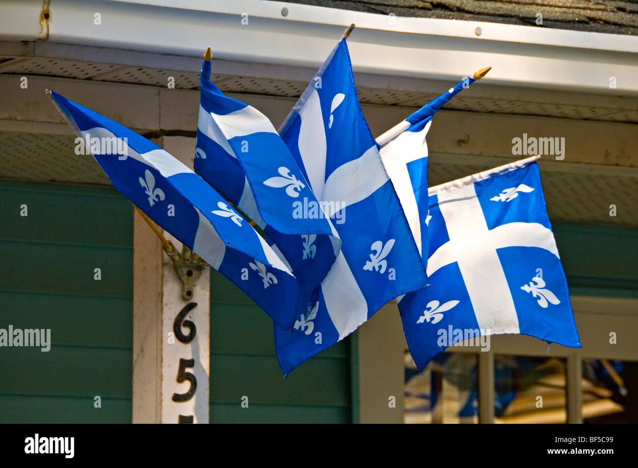Quebec flags on a house in the Village of St Denis sur Richelieu Quebec Canada Stock Photo