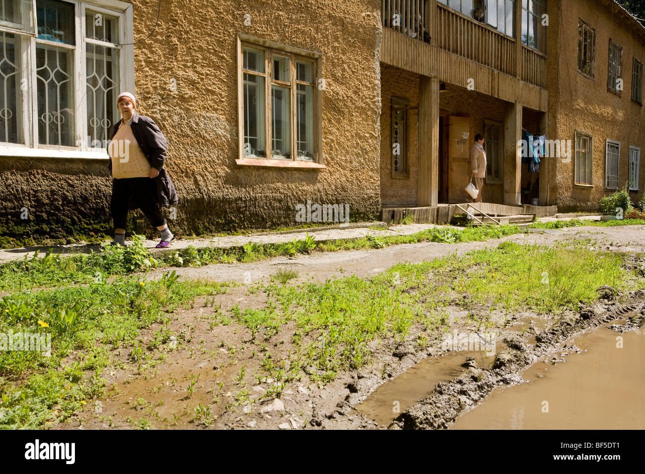 Residential street with muddy puddles, Ural Mash, Yekaterinburg, Russia