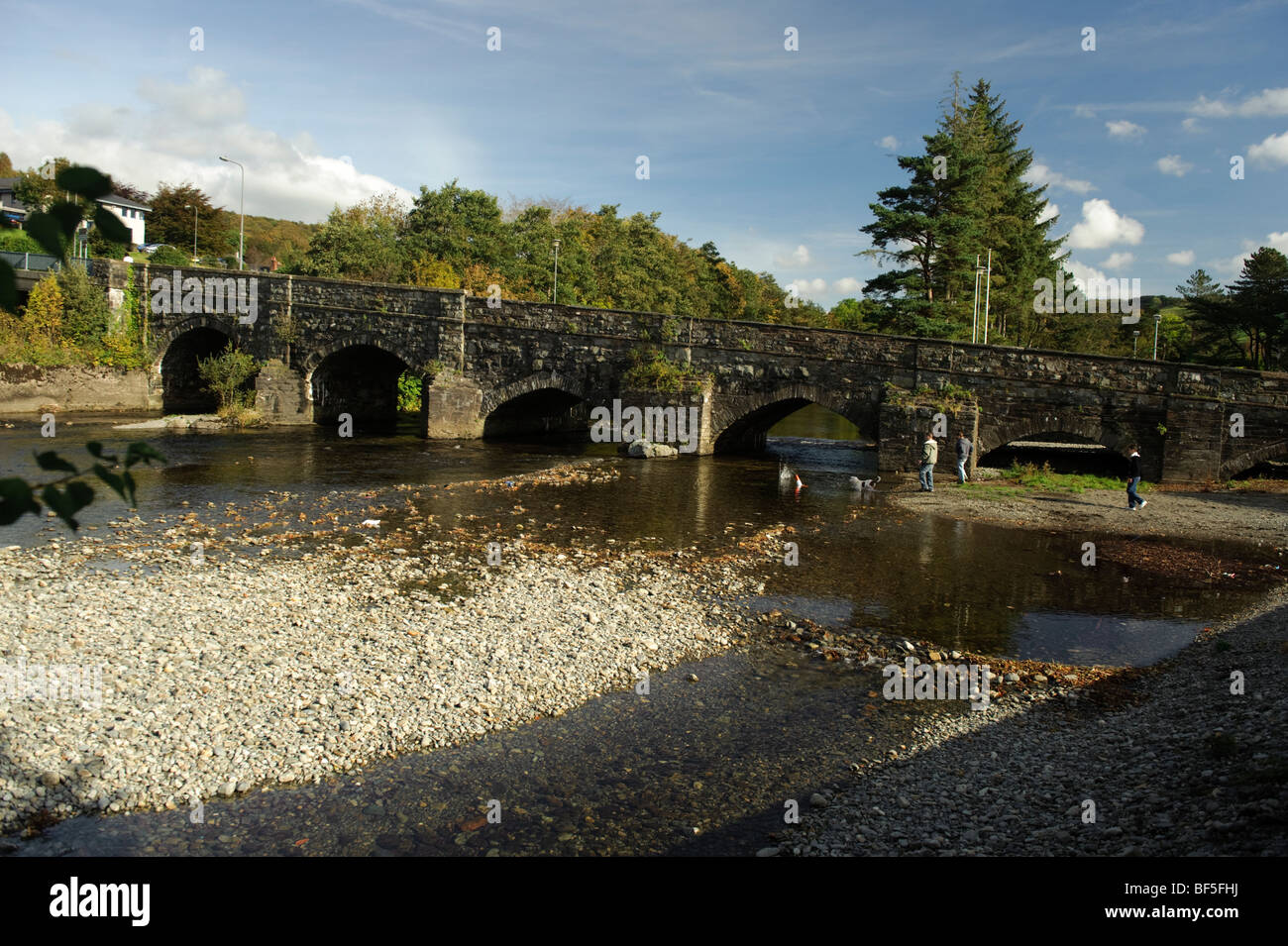 The old stone bridge across the River Wnion in Dolgellau, Gwynedd, Snowdonia National Park, Wales UK, autumn afternoon Stock Photo