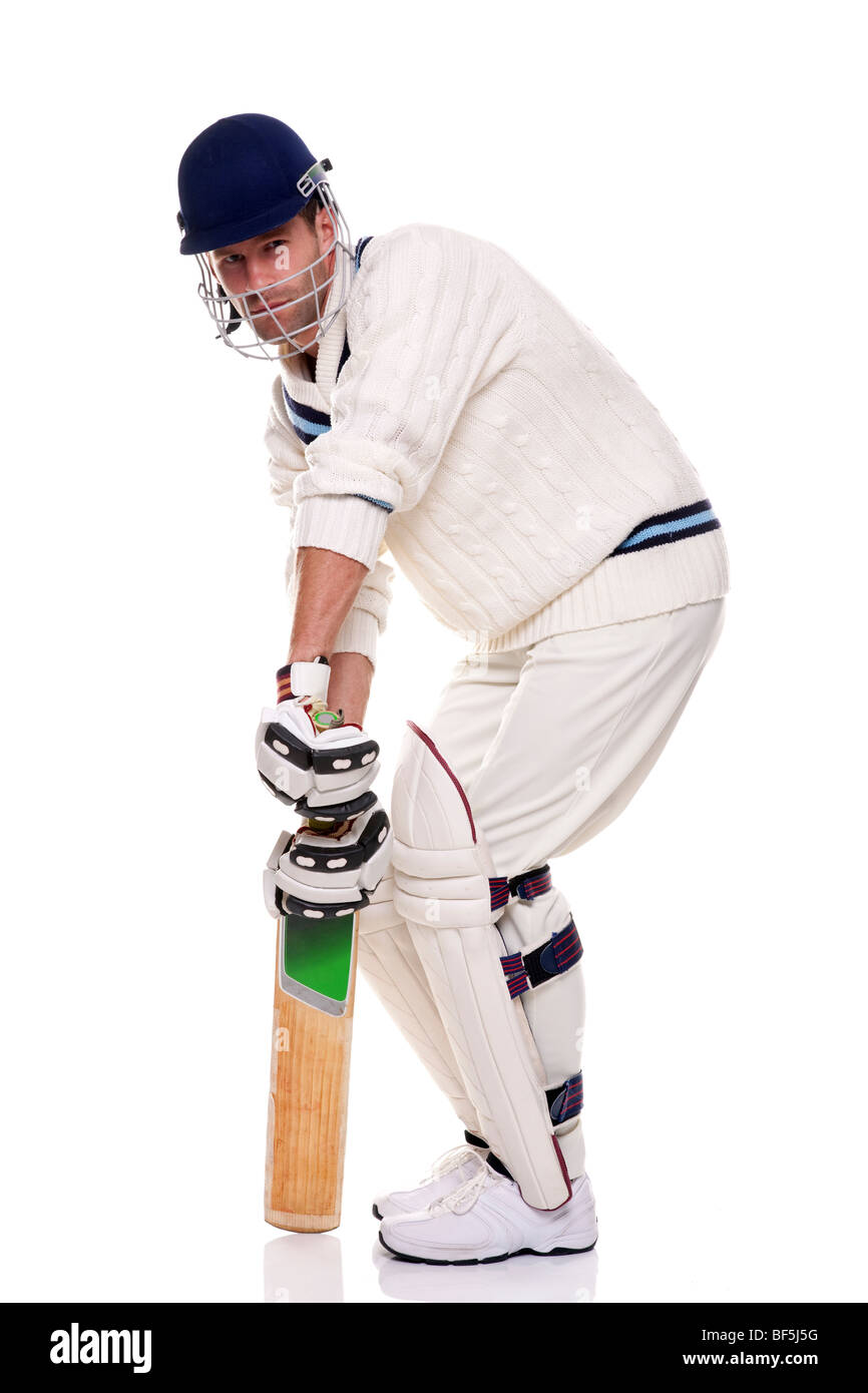 Cricketer, studio shot on white background. Stock Photo