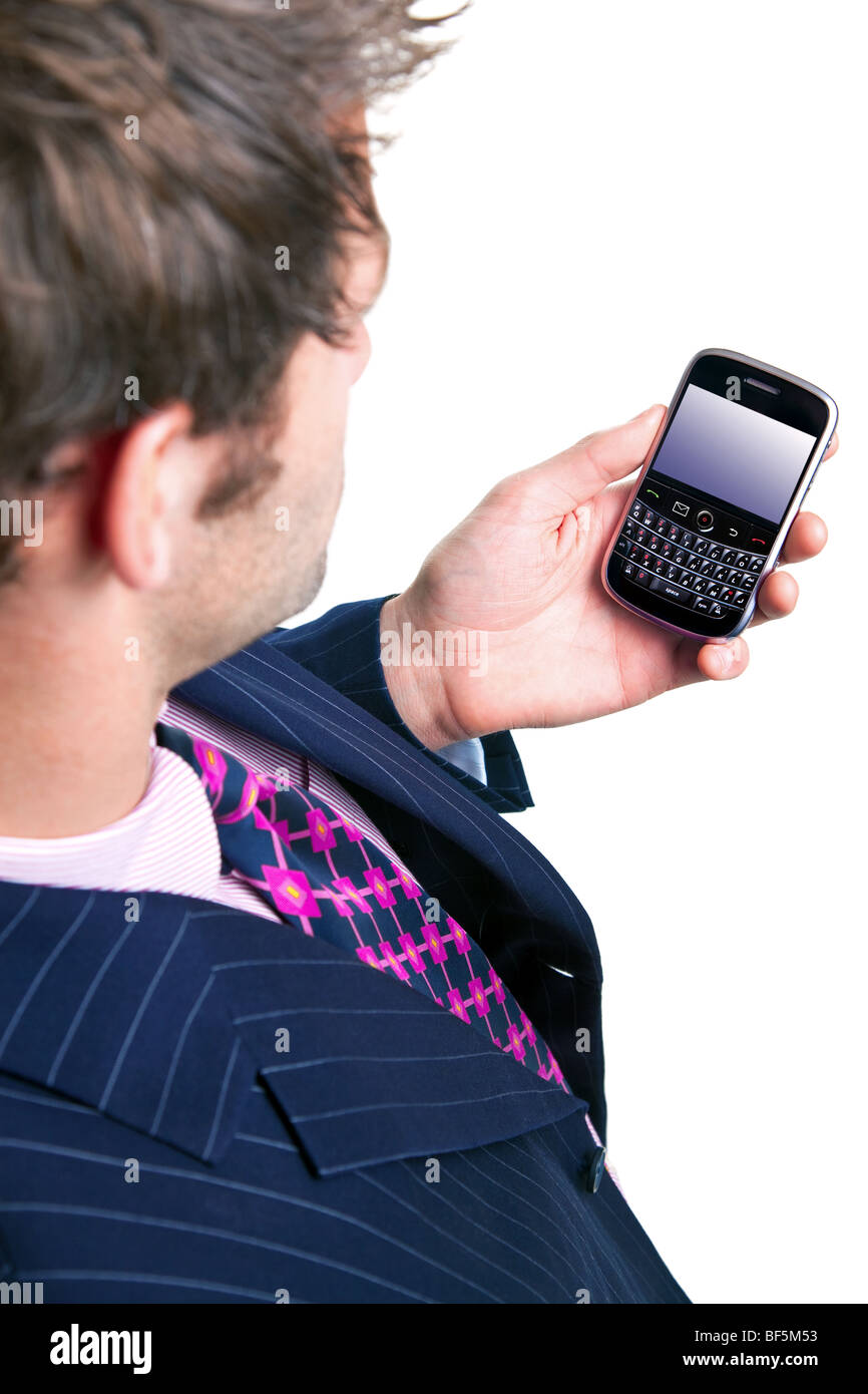 Businessman checking his phone for messages. Clipping path for screen. Stock Photo