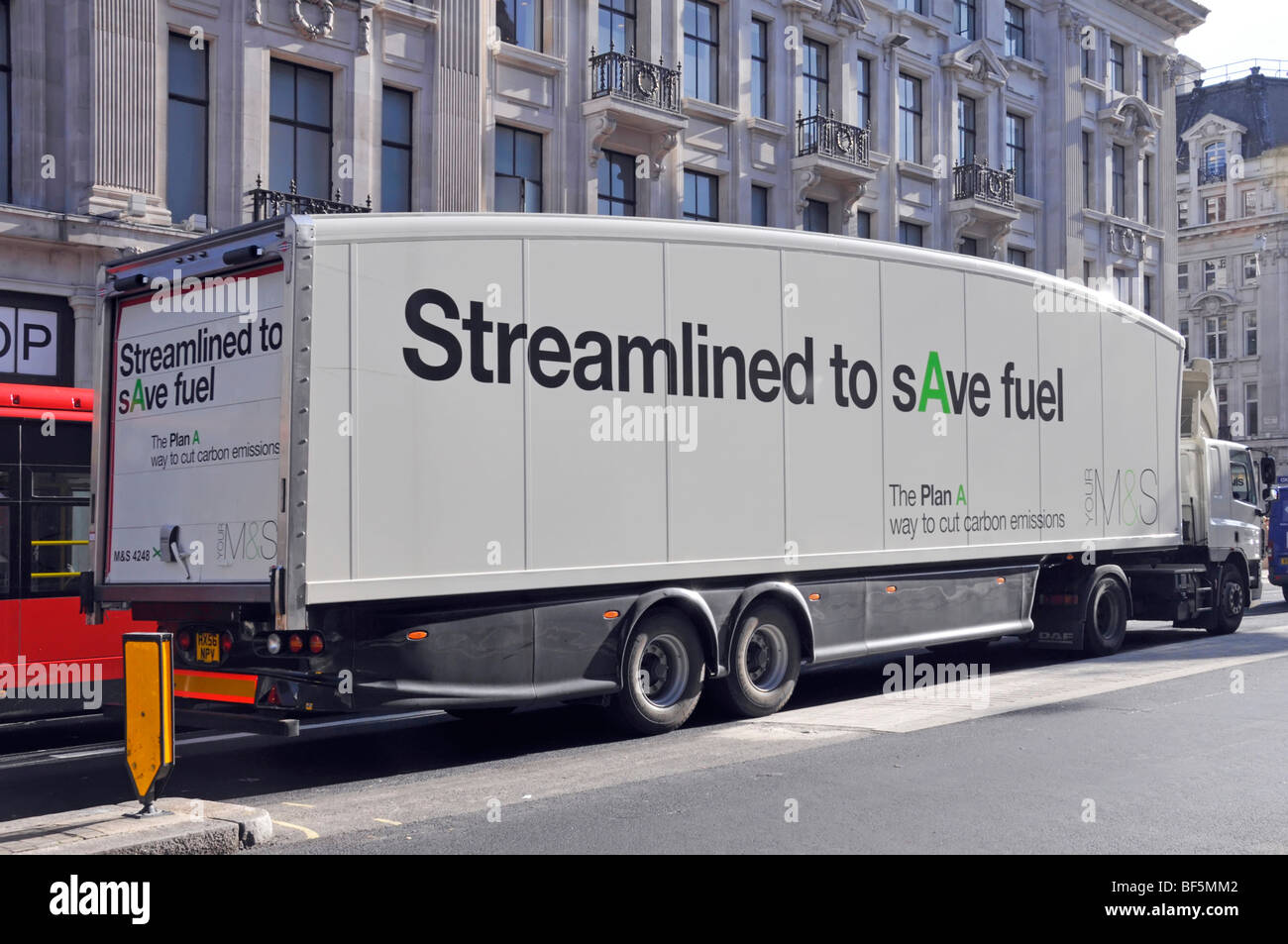 Marks and Spencer supply chain store delivery lorry truck streamlined aerodynamic M&S trailer shape to save fuel wait at Oxford Circus junction London Stock Photo
