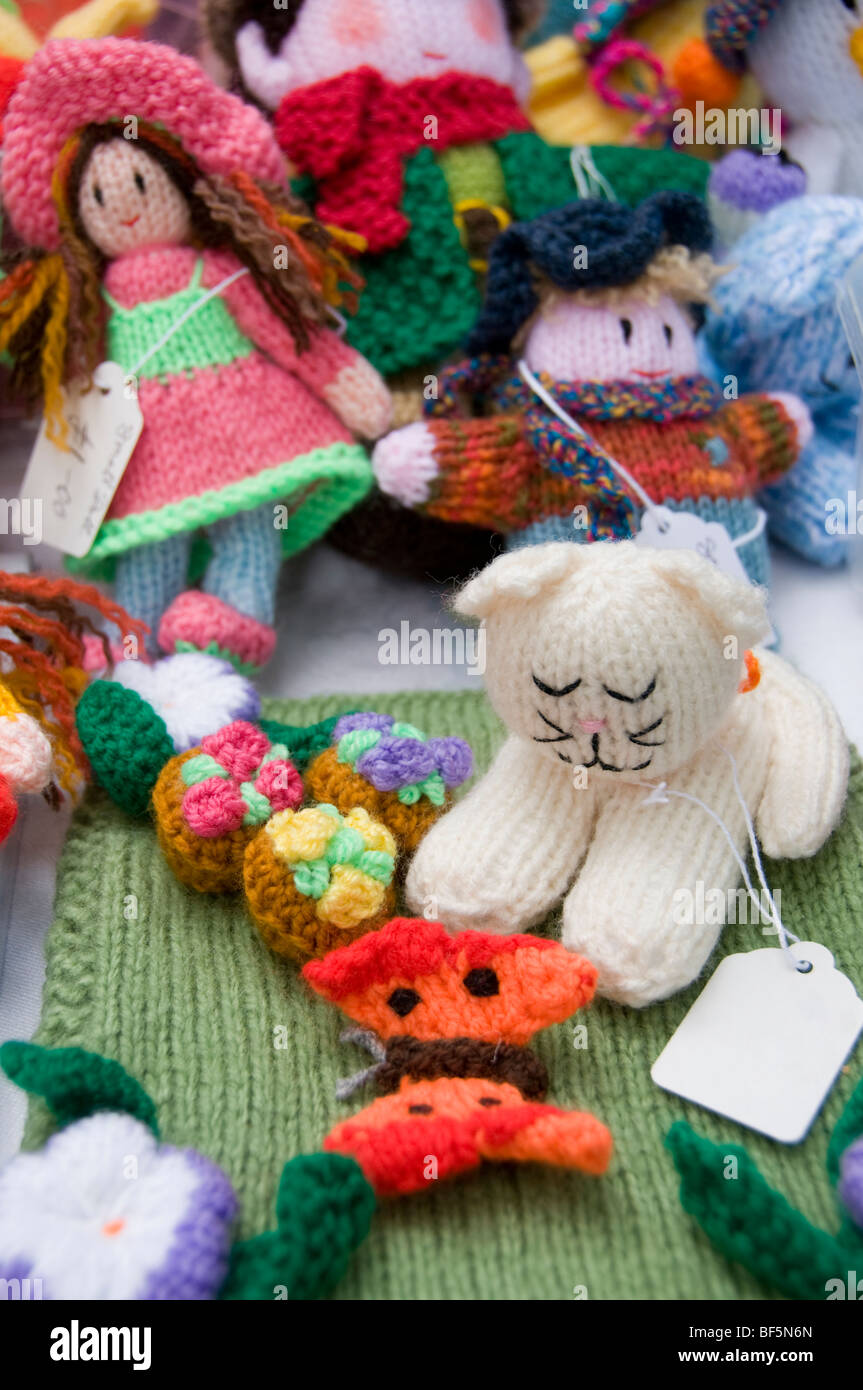 Knitted gifts on a summer fete stall Stock Photo