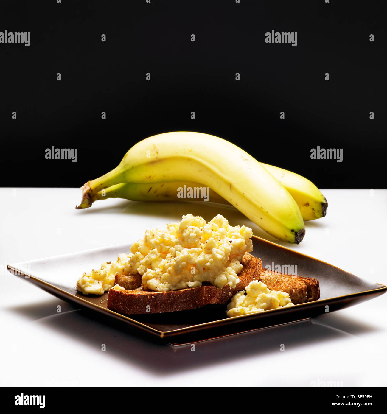 low calorie healthy choice of banana and eggs on toast Stock Photo Alamy