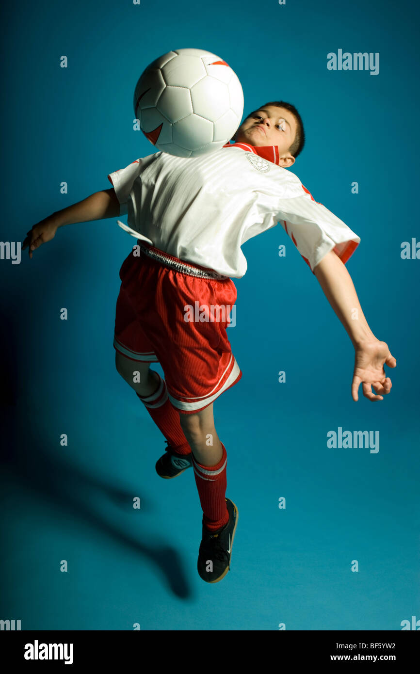 Kid chest soccer ball hires stock photography and images Alamy