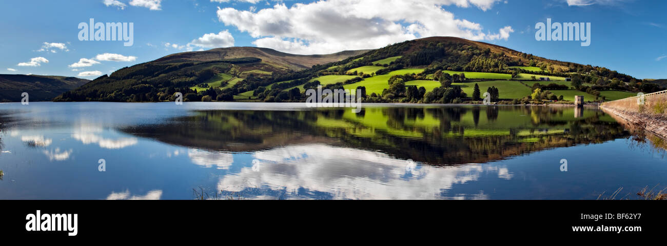 Perfect reflection at Talybont reservoir, Brecon Beacons in Wales taken on beautiful bright sunny day Stock Photo