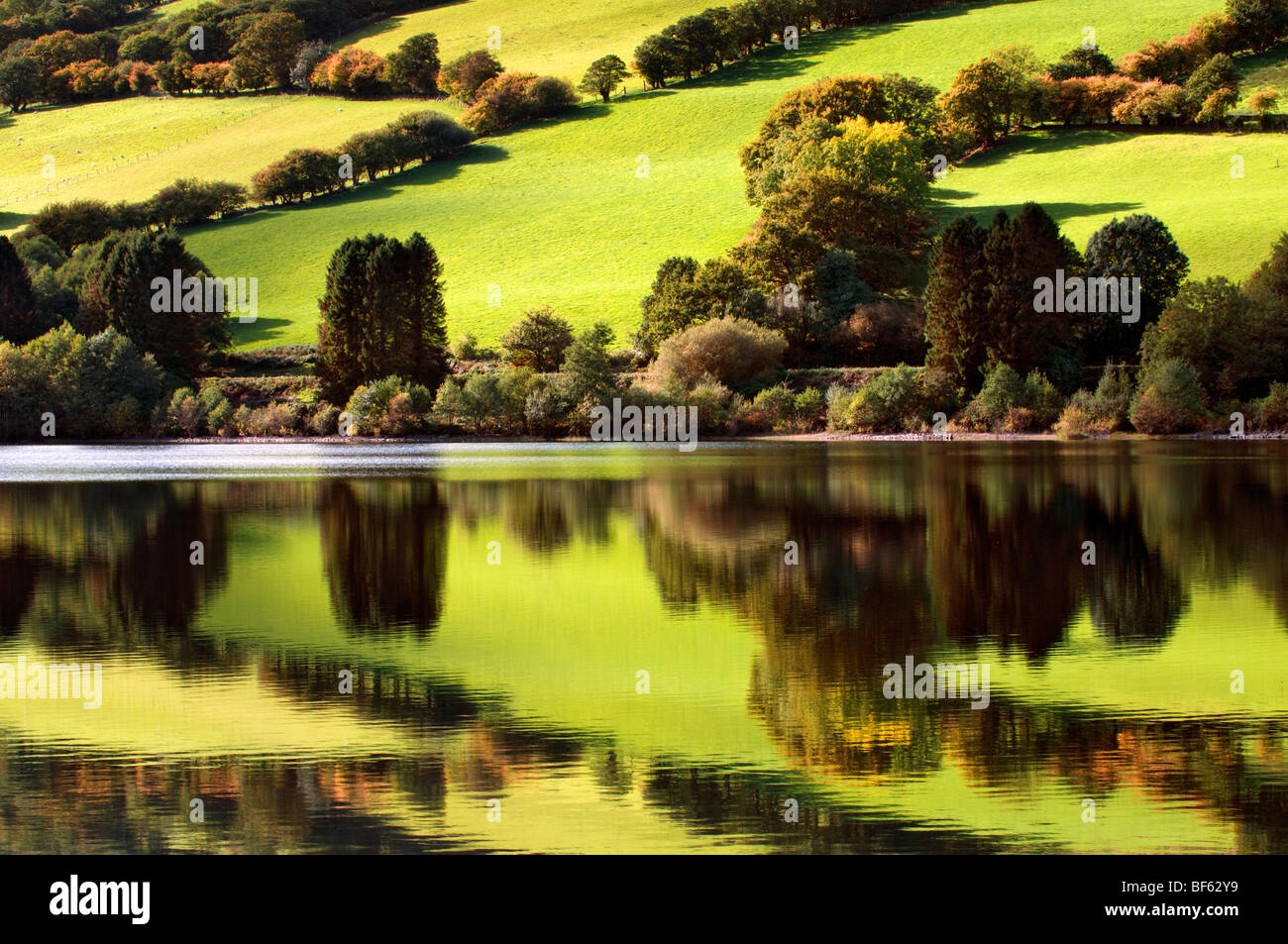 Perfect reflection at Talybont reservoir, Brecon Beacons in Wales taken on beautiful bright sunny day Stock Photo