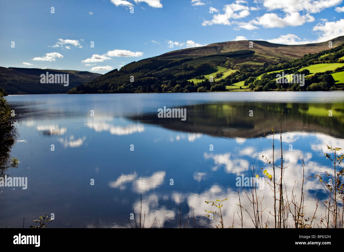 Perfect reflection at Talybont reservoir, Brecon Beacons in Wales taken on beautiful bright sunny day Stock Photo