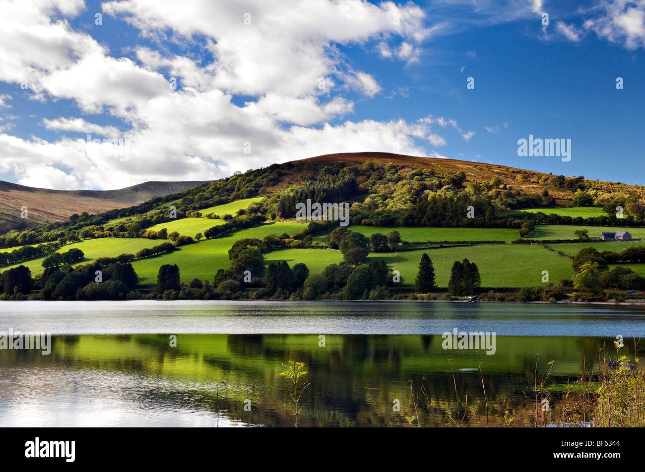 Perfect reflection at Talybont reservoir, Brecon Beacons in Wales taken on beautiful bright sunny day Stock Photo