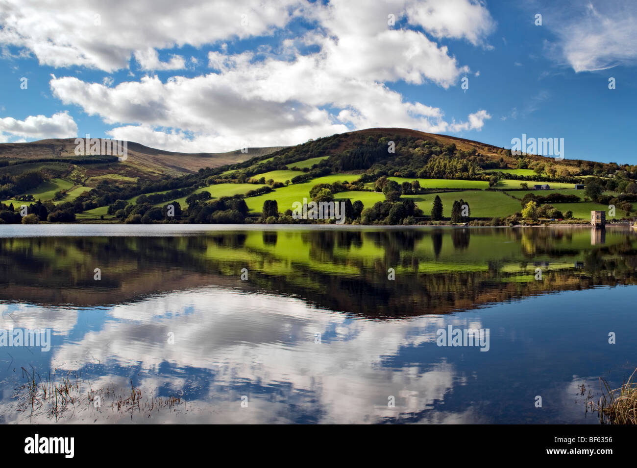 Perfect reflection at Talybont reservoir, Brecon Beacons in Wales taken on beautiful bright sunny day Stock Photo
