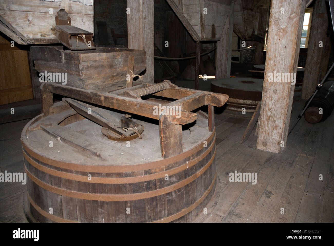 Grain grinding machinery inside the mill Three Mills Lea Valley North East London Stock Photo