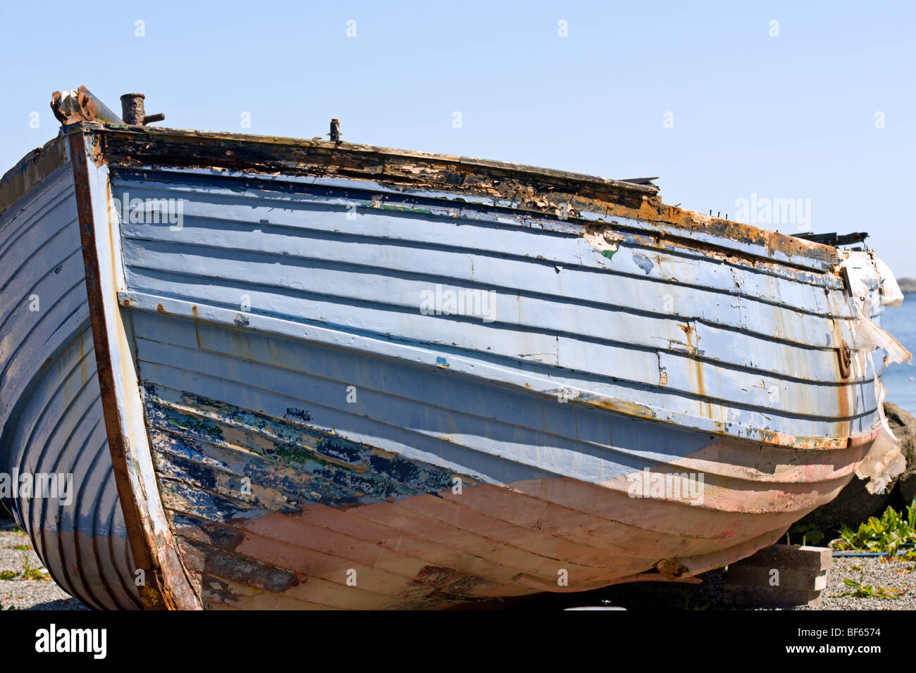 Wooden dinghy awaiting overhaul and repair Stock Photo