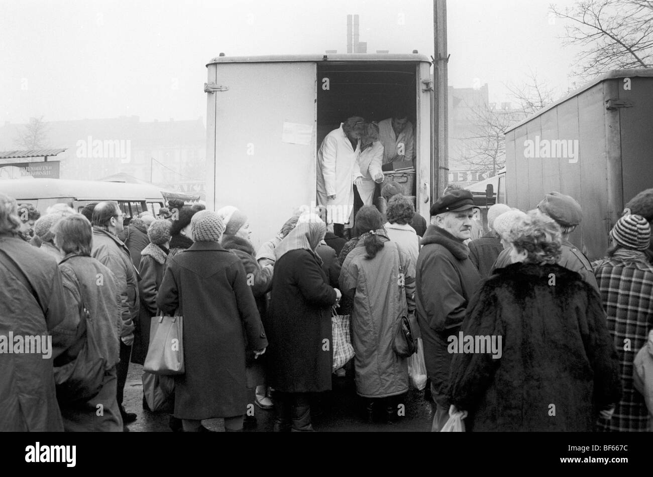 Poles queue for meat from back of truck, Krackow, Poland Stock Photo