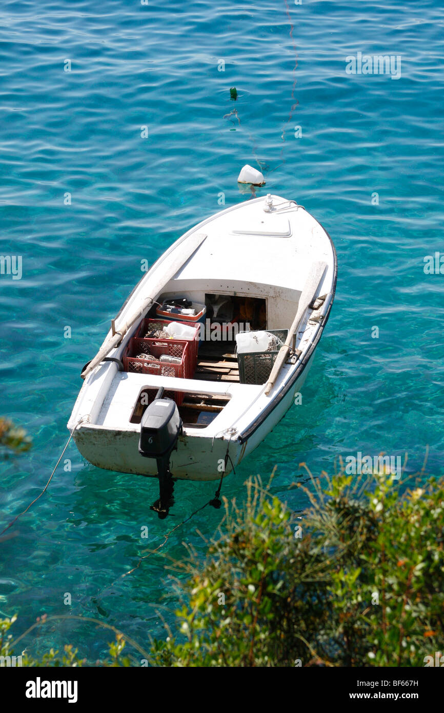 Old wooden fishing boat moored on mediterranean sea Stock Photo - Alamy