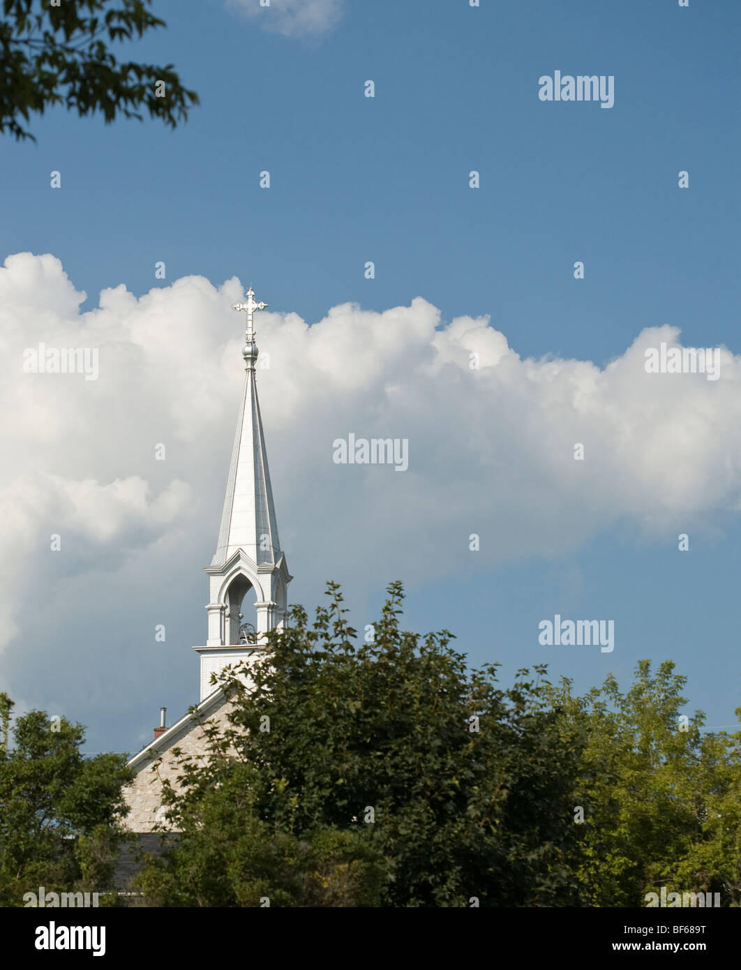 Silver Steeple at St James the Greater. Built of local stone in 1850, St James is an old Roman Catholic church in the Pontiac Stock Photo