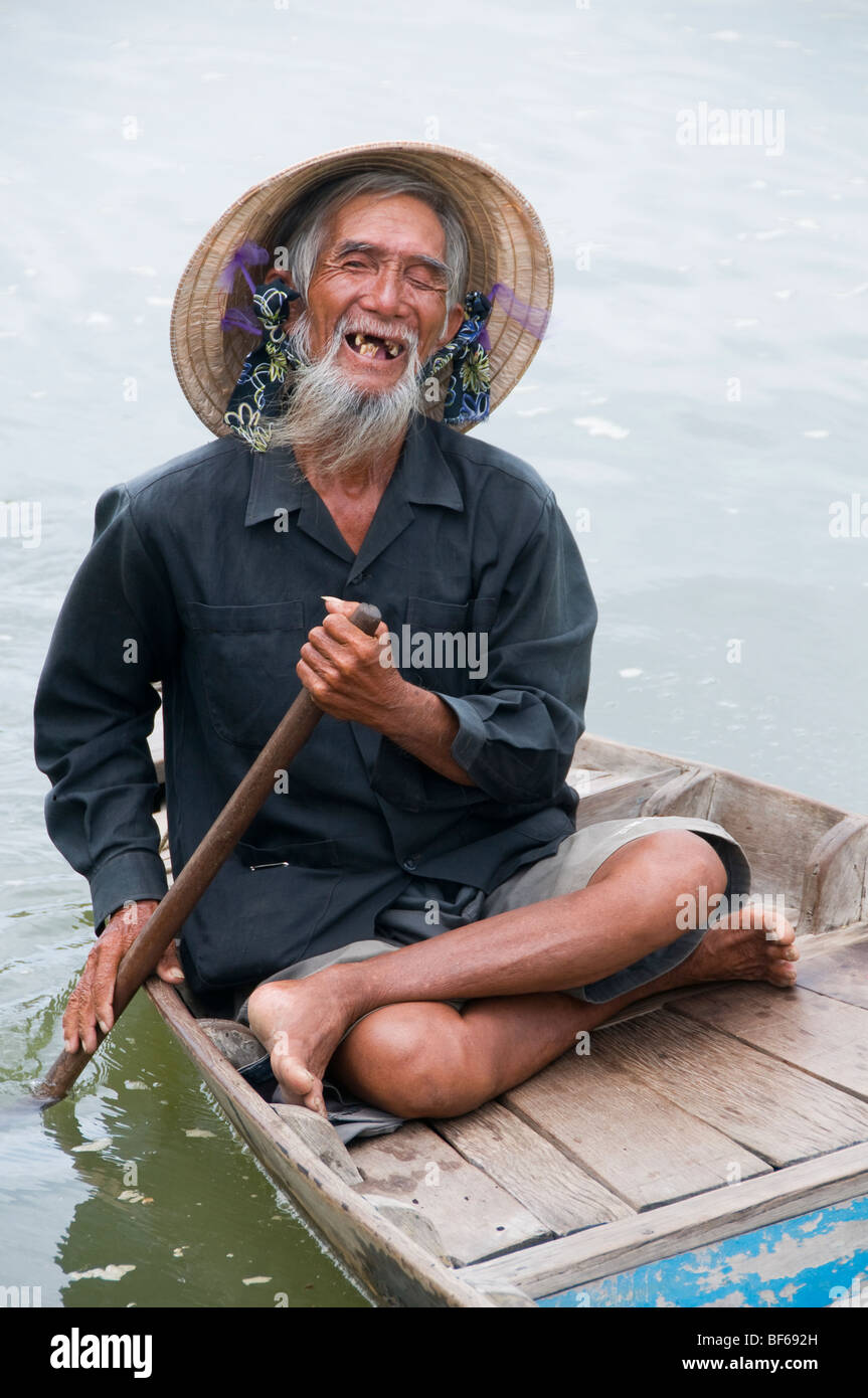Old man rowing his boat in Hoi An, Vietnam Stock Photo Alamy