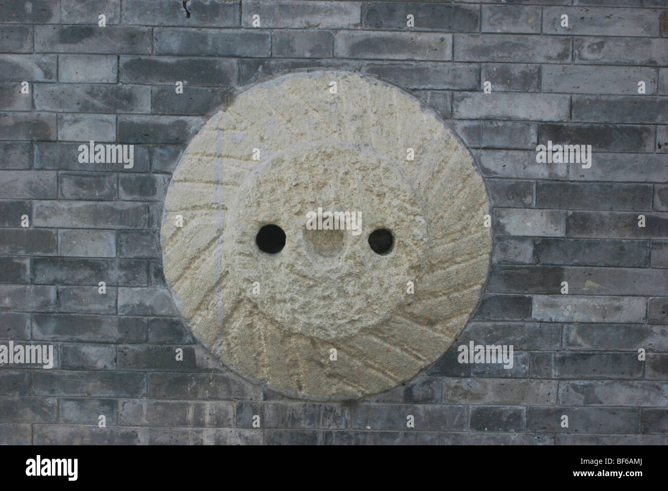 Hitching post for horses on the wall of large Hutong courtyard house, Beijing, China Stock Photo