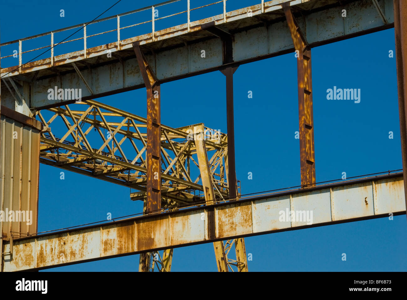 The steelwork of a crane in a disused boat yard in Savona Northern Italy Stock Photo