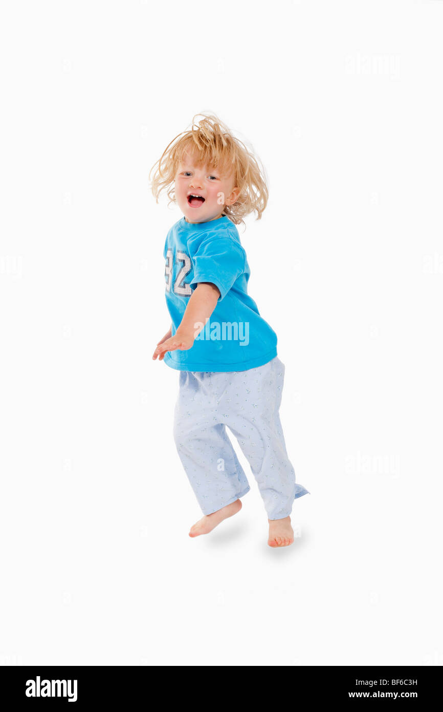 Excited 8year Old Mixed Race Boy Jumping On White Stock Photo - Download  Image Now - Child, Jumping, White Background - iStock