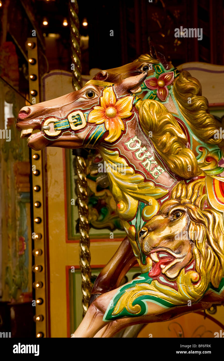 Closeup of painted wooden horse on traditional carousel. Stock Photo