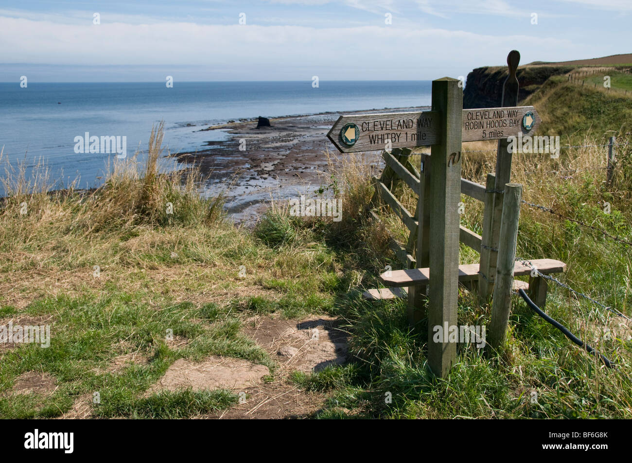 Signpost for walkers and hikers, Cleveland Way, Saltwick Bay, near Whitby, North Yorkshire, UK Stock Photo