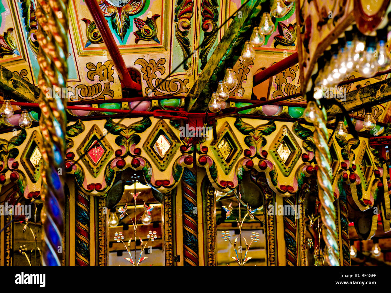 Closeup of ornate interior detail on traditional fairground carousel Stock Photo