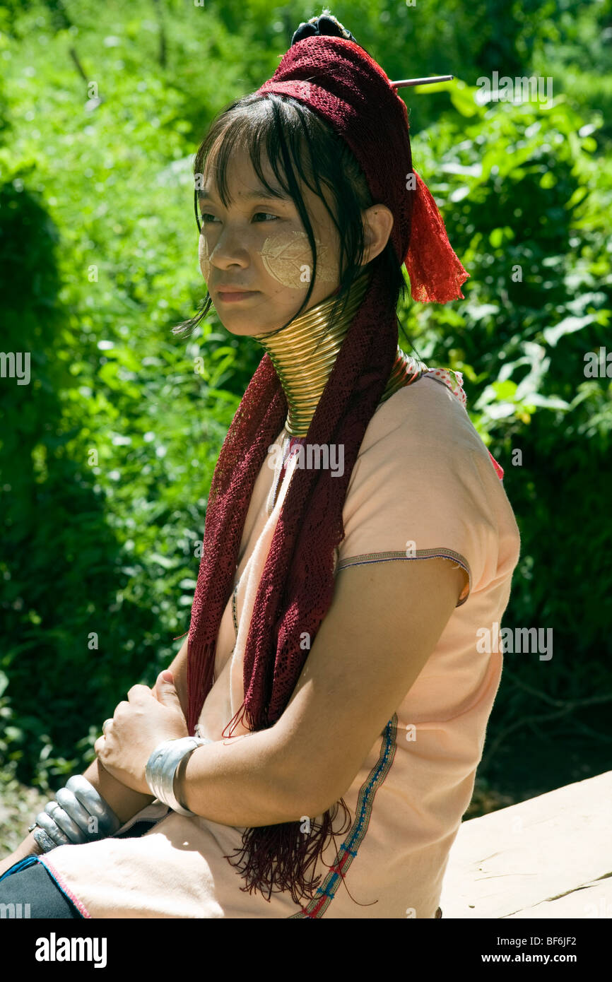 Young woman of long neck, Karen tribe in Northern Thailand Mae Hong Song with decorated face. Stock Photo