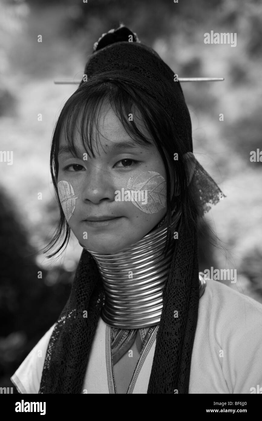 Young woman of long neck, Karen tribe in Northern Thailand Mae Hong Song with decorated face. Stock Photo