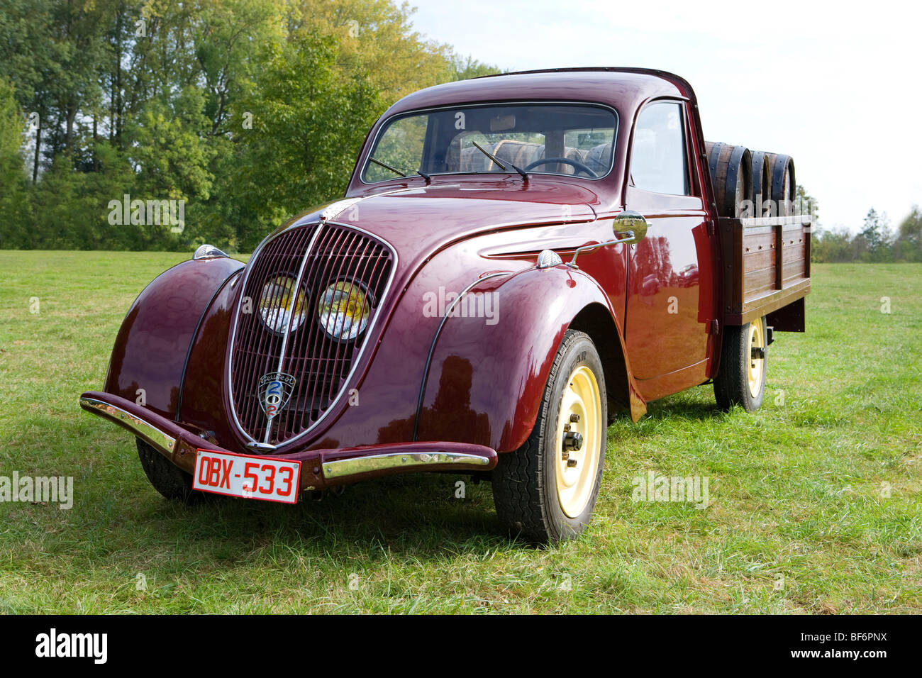 Peugeot 202, pick up, fifties, veteran car, loaded with barrique wine barrels Stock Photo