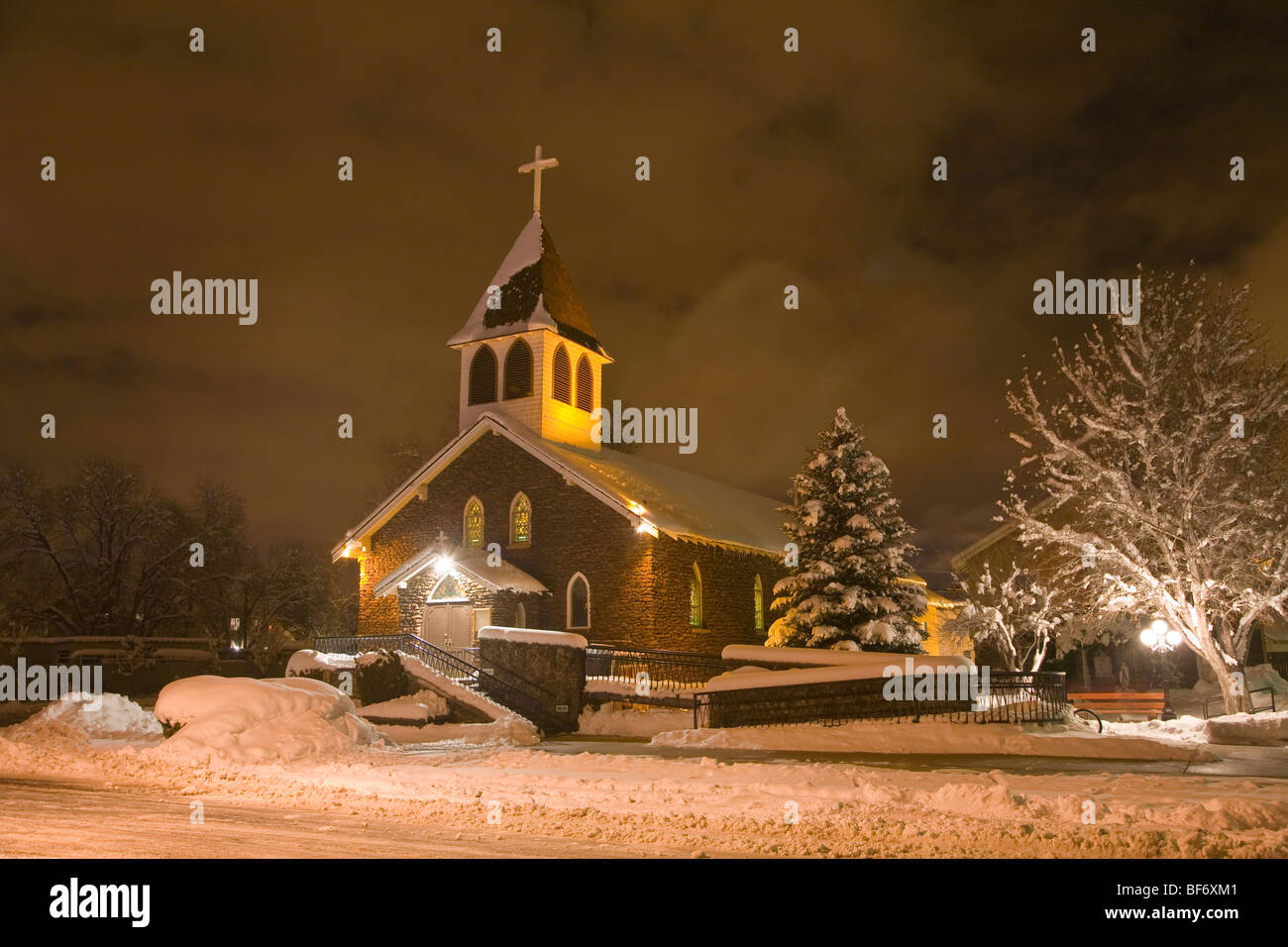 Our Lady of Guadalupe Catholic Church on snowy evening, in historic southside area of Flagstaff, Arizona, USA Stock Photo