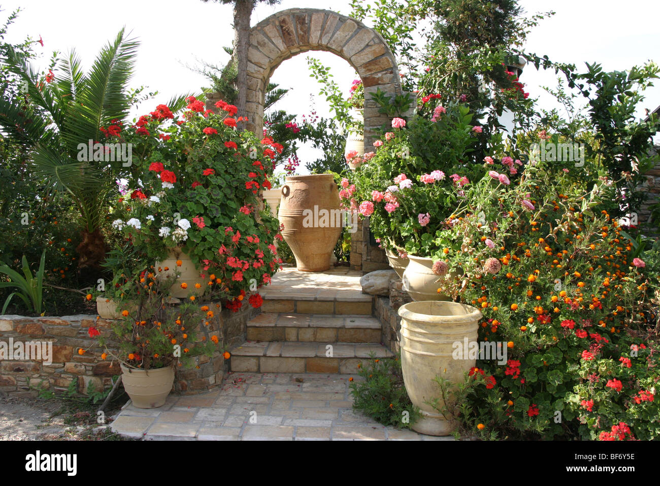 Garden entrance with flower pots Stock Photo - Alamy