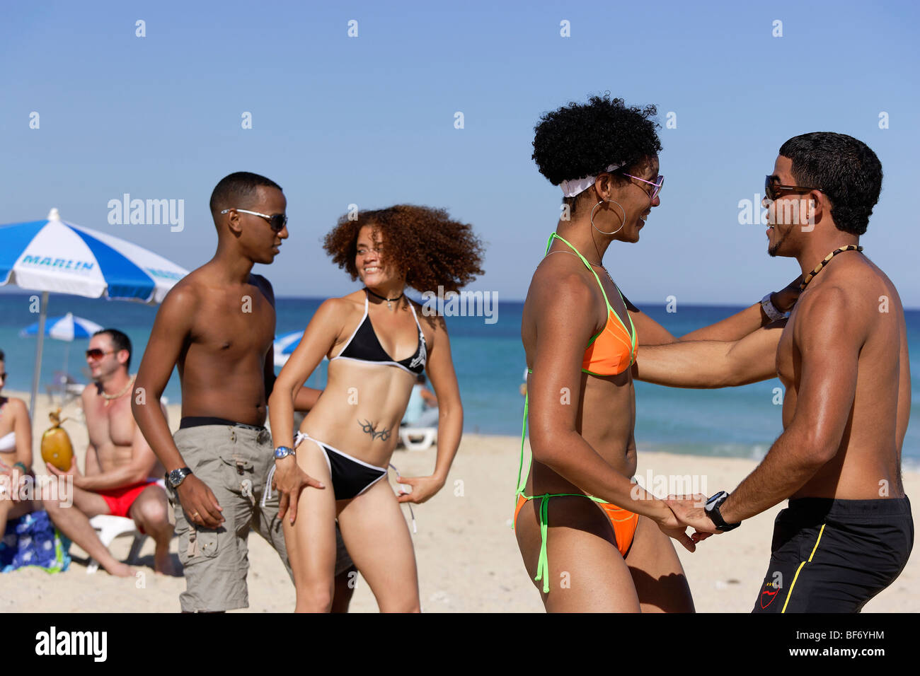 Young people dancing salsa at beach, Playas del Este, Havana, Ciudad de La Habana, Cuba, West Indies Stock Photo