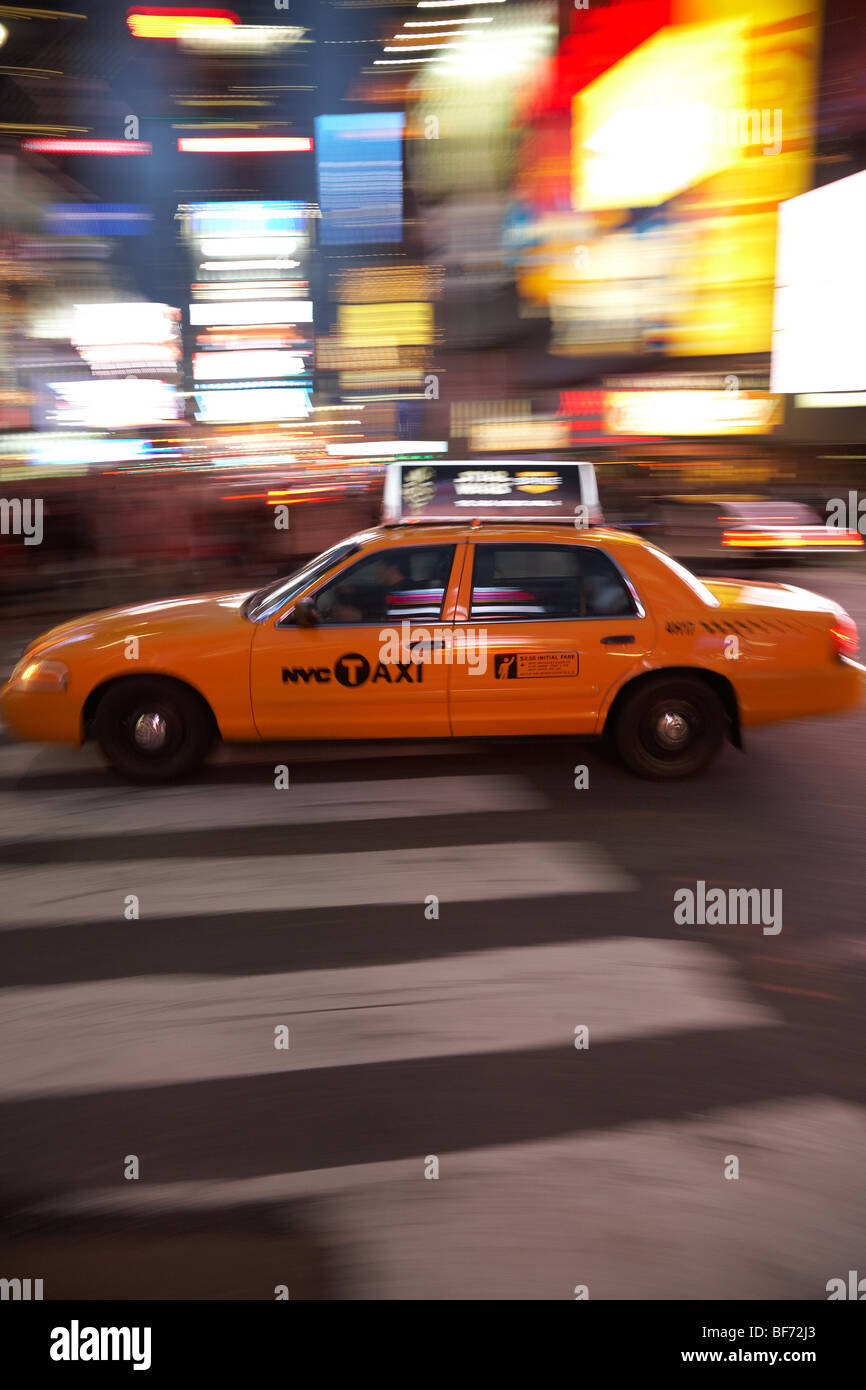 New York taxi on the move through Times Square, Manhattan, New York Stock Photo