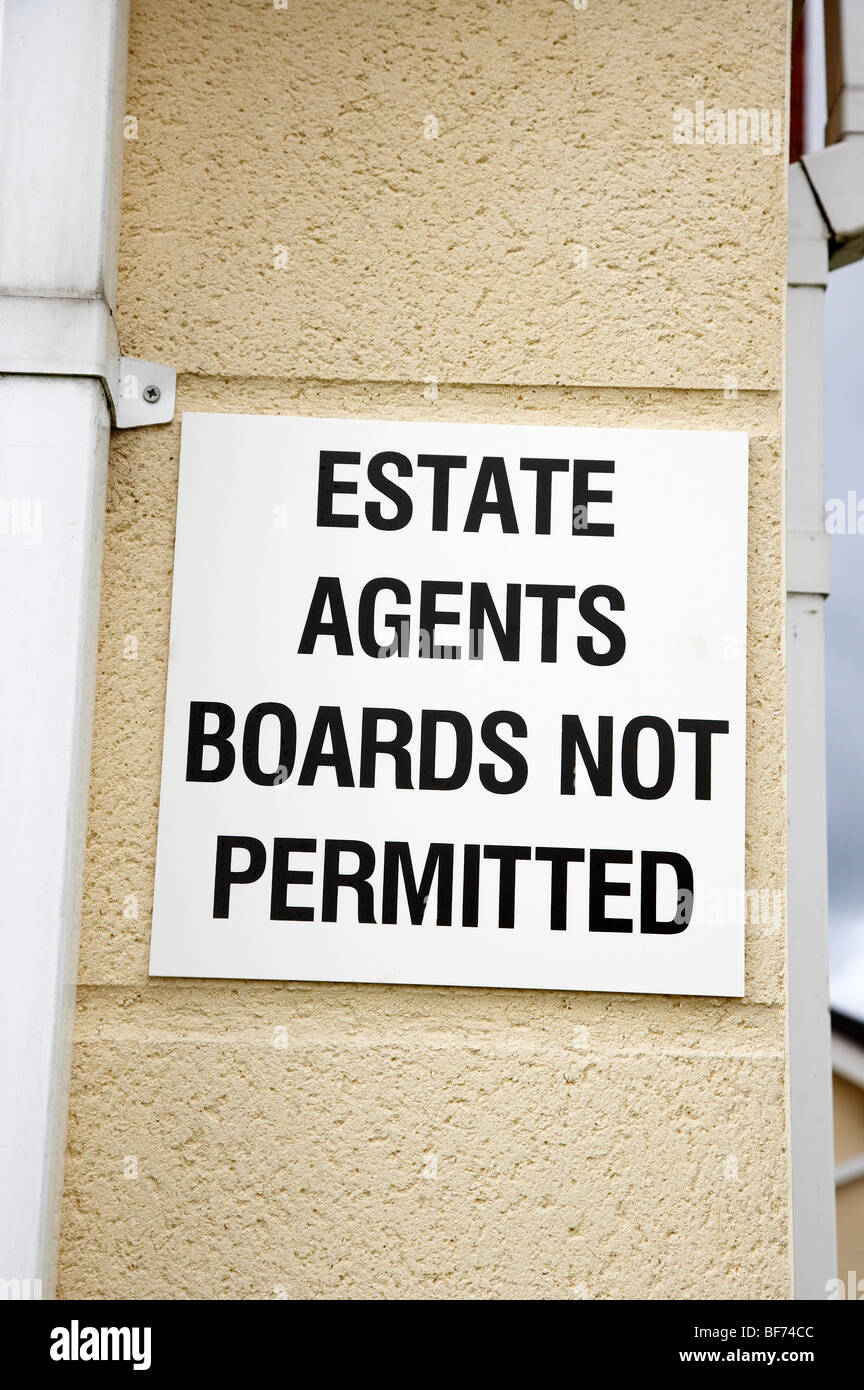 Estate agents boards not permitted sign outside residential properties Stock Photo