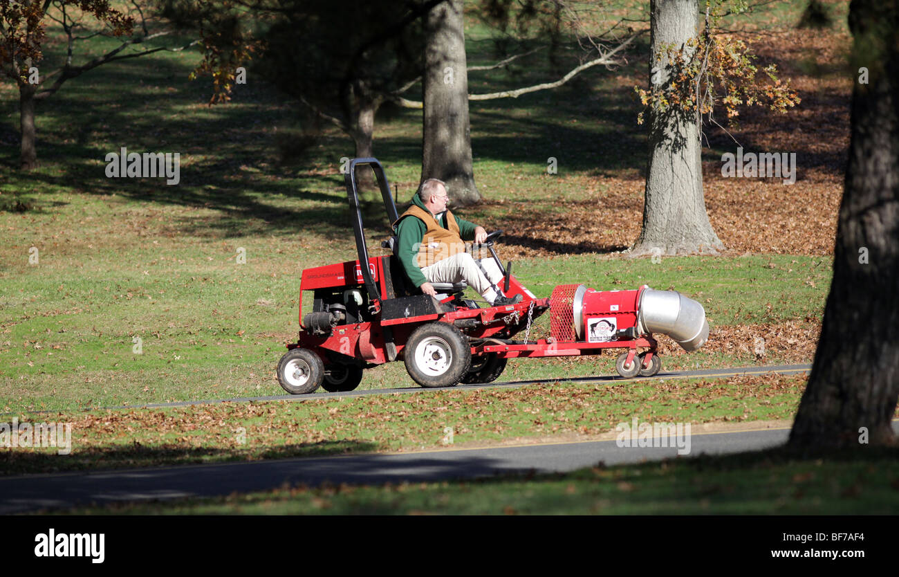 A Toro groundsmaster 328 D fitted with a front power leaf blower attachment. Park and grounds autumn leaf blowing Stock Photo Alamy
