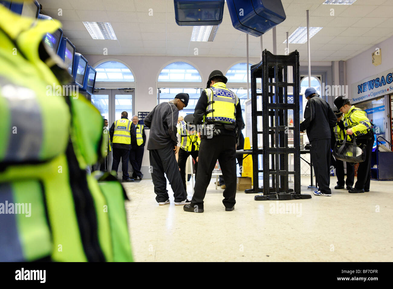 British Transport Police using the 'Knife Arch' detector during routine neighborhood policing at Lewisham train station. London Stock Photo