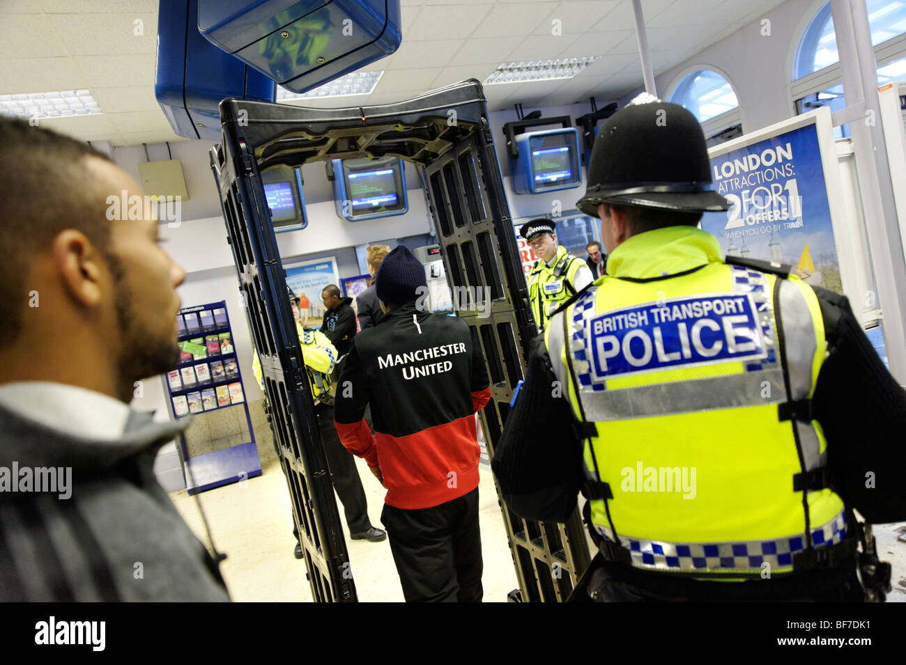 British Transport Police using the 'Knife Arch' detector during routine neighborhood policing at Lewisham train station. London Stock Photo