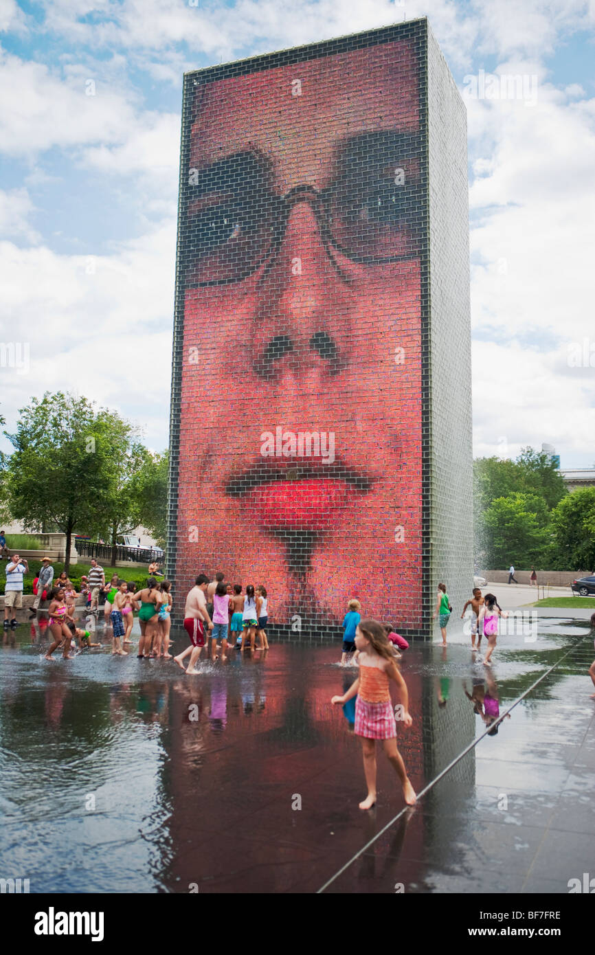 children play in the Crown Fountain, Millenium Park, Chicago, Illinois, United States of America Stock Photo