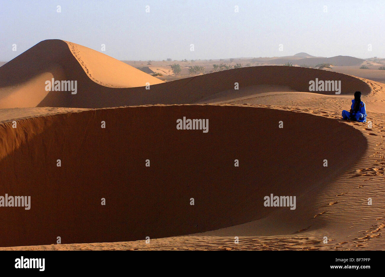 Mauritania: A tuareg seated on a dune Stock Photo