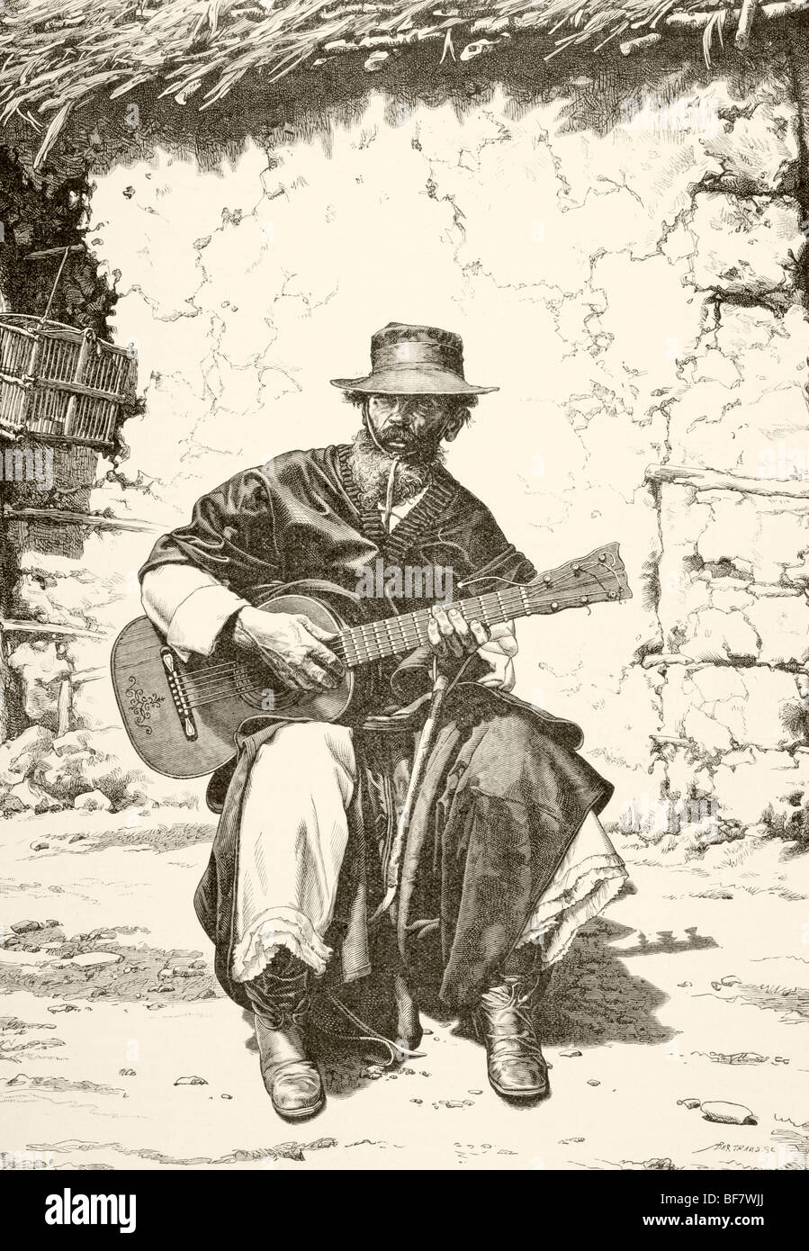 A 19th century Argentinian gaucho, or cowboy, play the guitar Stock