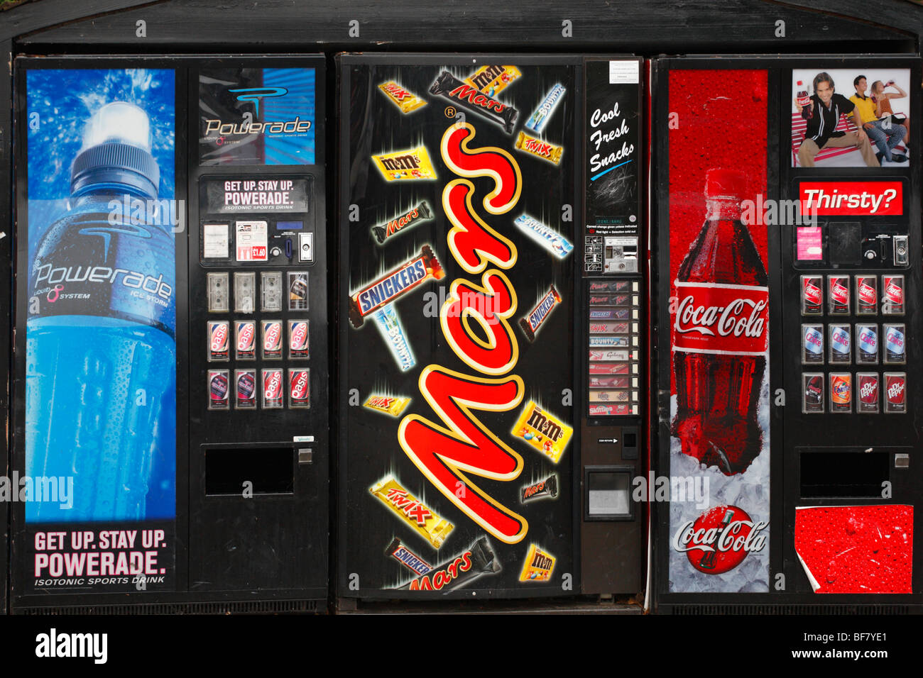 Vending machines offering fizzy drinks and chocolate bars. Stock Photo