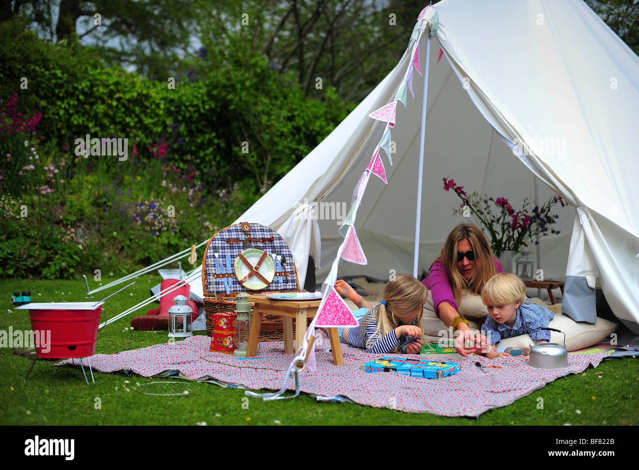 A Family Camping With A Fabric Tent In Their Garden In Devon Uk Stock Photo Alamy