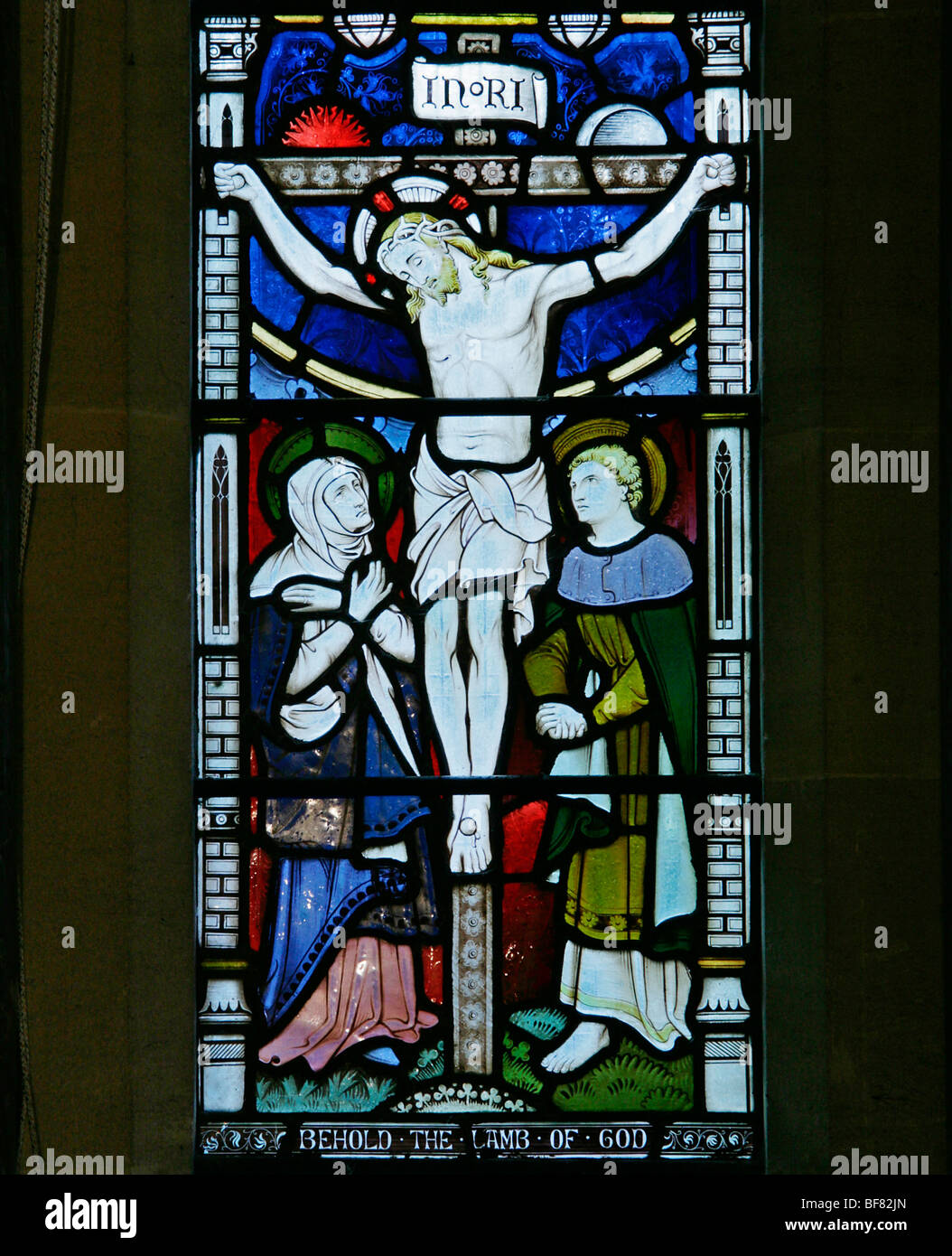 A stained glass window depicting the Crucifixion of Jesus Christ, Church of St Mary, South Tidworth, Wiltshire Stock Photo